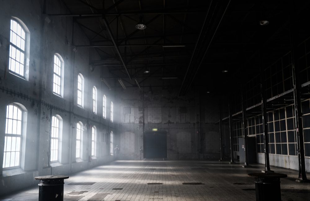 Alone in the Dimly Lit Warehouse ©Mozo Productions/Shutterstock.com